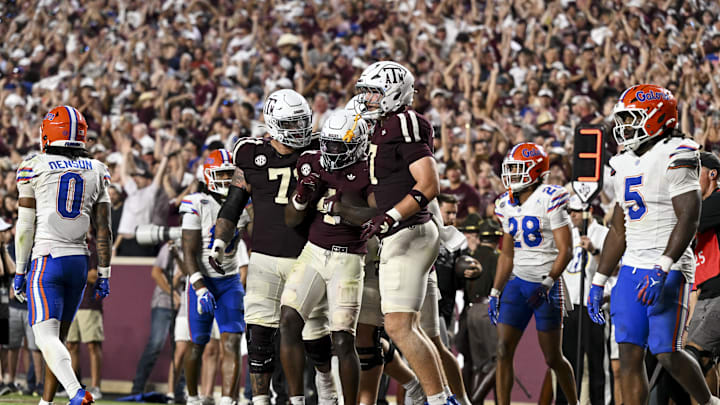 Oct 11, 2025; College Station, Texas, USA; Texas A&M Aggies running back Rueben Owens II (4) celebrates his touchdown with teammates during the fourth quarter against the Florida Gators at Kyle Field. Mandatory Credit: Maria Lysaker-Imagn Images 