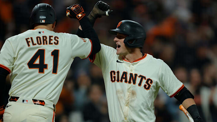 Apr 21, 2025; San Francisco, California, USA; San Francisco Giants second baseman Tyler Fitzgerald (49) celebrates with designated hitter Wilmer Flores (41) after hitting a one run home run during the sixth inning against the Milwaukee Brewers at Oracle Park. Apr 21, 2025; San Francisco, California, USA; San Francisco Giants second baseman Tyler Fitzgerald (49) celebrates with designated hitter Wilmer Flores (41) after hitting a one run home run during the sixth inning against the Milwaukee Brewers at Oracle Park.