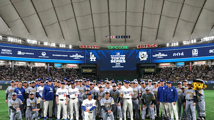 Mar 16, 2025; Bunkyo, Tokyo, Japan; The Los Angeles Dodgers and the Hanshin Tigers pose for a photo after the game at Tokyo Dome. Mandatory Credit: Darren Yamashita-Imagn Images Mar 16, 2025; Bunkyo, Tokyo, Japan; The Los Angeles Dodgers and the Hanshin Tigers pose for a photo after the game at Tokyo Dome. Mandatory Credit: Darren Yamashita-Imagn Images