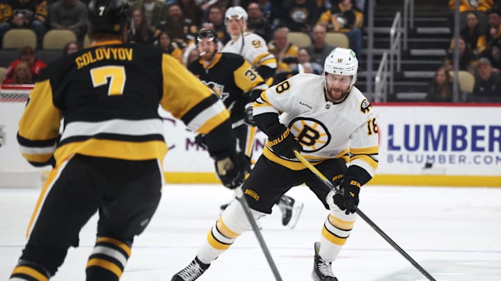 Mar 8, 2026; Pittsburgh, Pennsylvania, USA;  Boston Bruins center Pavel Zacha (18) skates up ice with the puck as Pittsburgh Penguins defenseman Ilya Solovyov (7) defends during the third period at PPG Paints Arena. Mandatory Credit: Charles LeClaire-Imagn Images