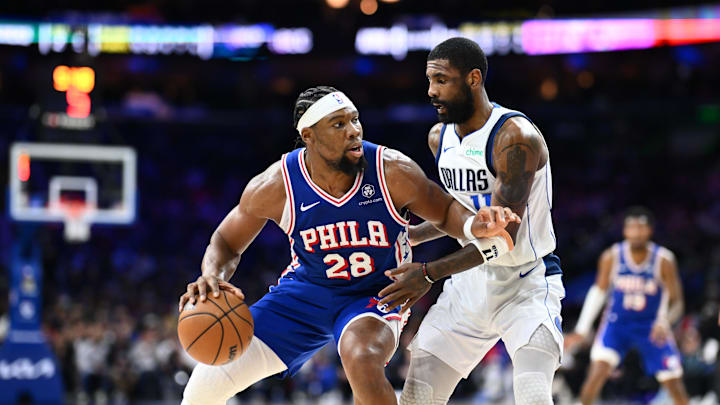 Feb 4, 2025; Philadelphia, Pennsylvania, USA; Philadelphia 76ers forward Guerschon Yabusele (28) drives against Dallas Mavericks guard Kyrie Irving (11) in the third quarter at Wells Fargo Center. Mandatory Credit: Kyle Ross-Imagn Images
