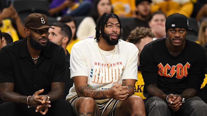 Oct 4, 2024; Palm Desert, California, USA; Los Angeles Lakers forward Anthony Davis (3), forward LeBron James (23) and forward Jarred Vanderbilt (2) on the sidelines against the Minnesota Timberwolves during the second half at Acrisure Arena. Mandatory Credit: Jonathan Hui-Imagn Images