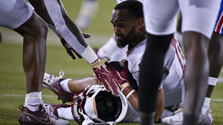 Sep 28, 2024; Dallas, Texas, USA; Florida State Seminoles wide receiver Ja'Khi Douglas (0) loses his helmet after a run against the Southern Methodist Mustangs during the second quarter at Gerald J. Ford Stadium. Mandatory Credit: Jerome Miron-Imagn Images