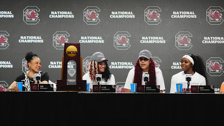 South Carolina basketball coach Dawn Staley with guards Raven Johnson and Te-Hina Paopao and center Kamilla Cardoso