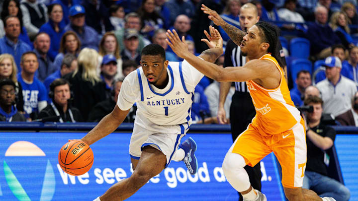 Feb 11, 2025; Lexington, Kentucky, USA; Kentucky Wildcats guard Lamont Butler (1) drives to the basket around Tennessee Volunteers guard Zakai Zeigler (5) during the second half at Rupp Arena at Central Bank Center. Mandatory Credit: Jordan Prather-Imagn Images Feb 11, 2025; Lexington, Kentucky, USA; Kentucky Wildcats guard Lamont Butler (1) drives to the basket around Tennessee Volunteers guard Zakai Zeigler (5) during the second half at Rupp Arena at Central Bank Center. Mandatory Credit: Jordan Prather-Imagn Images