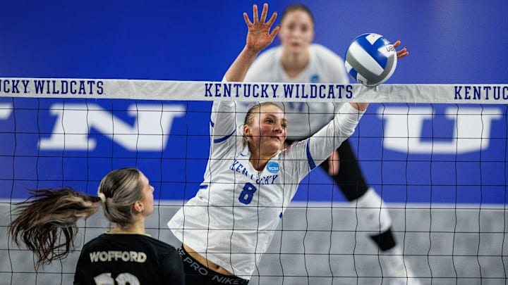 Dec 4, 2025; Lexington, KY, USA; Kentucky Wildcats middle blocker Brooke Bultema (8) blocks the ball at the net during the second set against the Wofford Terriers at Historic Memorial Coliseum. Mandatory Credit: Jordan Prather-Imagn Images
