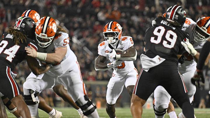 Nov 14, 2025; Louisville, Kentucky, USA;  Clemson Tigers running back Gideon Davidson (9) runs the ball against the Louisville Cardinals during the second half at L&N Federal Credit Union Stadium. Clemson defeated Louisville 20-19. Mandatory Credit: Jamie Rhodes-Imagn Images