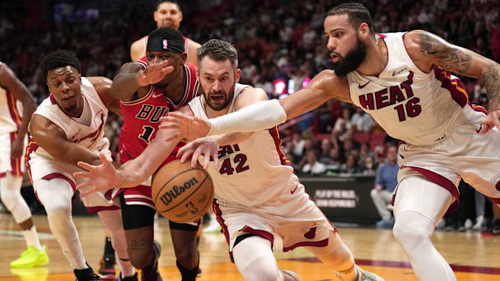 Dec 14, 2023; Miami, Florida, USA; Miami Heat forward Kevin Love (42) and forward Caleb Martin (16)