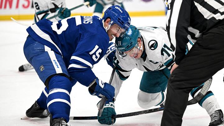 Oct 19, 2026; Toronto, Ontario, CAN;  Toronto Maple Leafs forward Colton Sissons (15) wins a faceoff against San Jose Sharks forward Macklin Celebrini (71) in the second period at Scotiabank Arena.  Mandatory Credit: Dan Hamilton-Imagn Images