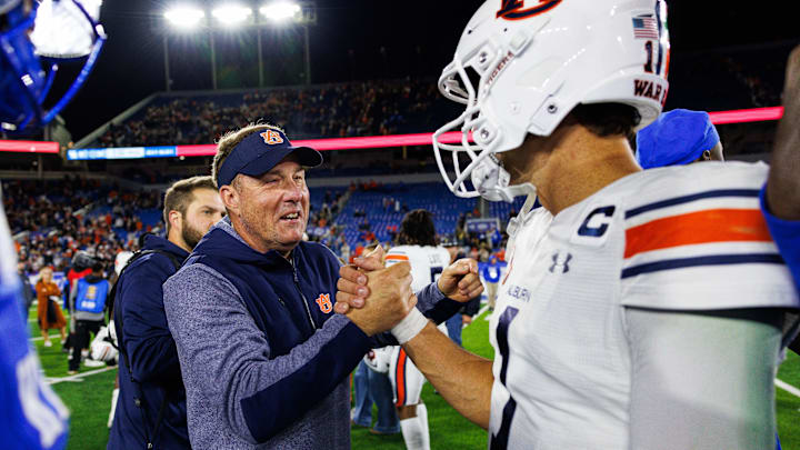 Oct 26, 2024; Lexington, Kentucky, USA; Auburn Tigers head coach Hugh Freeze celebrates with quarterback Payton Thorne (1) after the game at Kroger Field. Mandatory Credit: Jordan Prather-Imagn Images