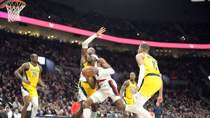 Jan 19, 2024; Portland, Oregon, USA; Portland Trail Blazers small forward Jerami Grant (9) drives to the basket while guarded by Indiana Pacers shooting guard Buddy Hield (7, behind) during the second half at Moda Center. Mandatory Credit: Soobum Im-Imagn Images Jan 19, 2024; Portland, Oregon, USA; Portland Trail Blazers small forward Jerami Grant (9) drives to the basket while guarded by Indiana Pacers shooting guard Buddy Hield (7, behind) during the second half at Moda Center. Mandatory Credit: Soobum Im-Imagn Images