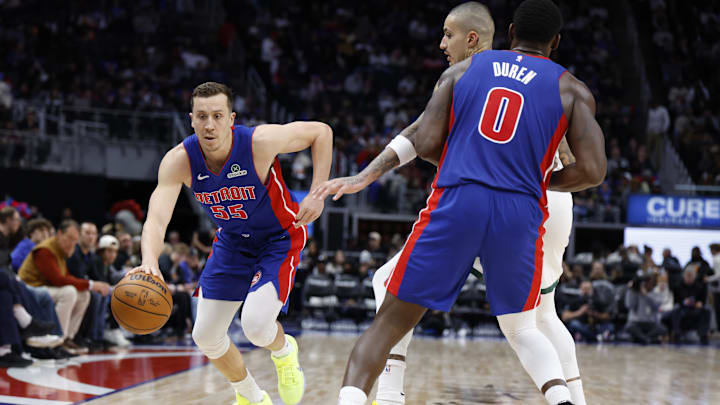 Dec 6, 2025; Detroit, Michigan, USA;  Detroit Pistons forward Duncan Robinson (55) dribbles in the second half against the Milwaukee Bucks at Little Caesars Arena. Mandatory Credit: Rick Osentoski-Imagn Images