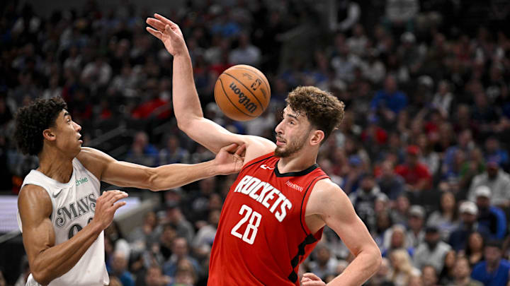 Feb 8, 2025; Dallas, Texas, USA; Dallas Mavericks guard Max Christie (00) and Houston Rockets center Alperen Sengun (28) in action during the game between the Dallas Mavericks and the Houston Rockets at the American Airlines Center. Mandatory Credit: Jerome Miron-Imagn Images