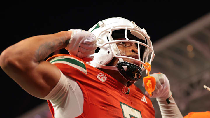 Sep 6, 2025; Miami Gardens, Florida, USA; Miami Hurricanes wide receiver CJ Daniels (7) celebrates after scoring a touchdown against the Bethune-Cookman Wildcats during the second quarter at Hard Rock Stadium. Mandatory Credit: Sam Navarro-Imagn Images Sep 6, 2025; Miami Gardens, Florida, USA; Miami Hurricanes wide receiver CJ Daniels (7) celebrates after scoring a touchdown against the Bethune-Cookman Wildcats during the second quarter at Hard Rock Stadium. Mandatory Credit: Sam Navarro-Imagn Images