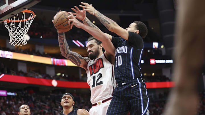 Mar 10, 2025; Houston, Texas, USA; Houston Rockets center Steven Adams (12) attempts to secure a rebound away from Orlando Magic guard Cole Anthony (50) during the second quarter at Toyota Center. Mandatory Credit: Troy Taormina-Imagn Images Mar 10, 2025; Houston, Texas, USA; Houston Rockets center Steven Adams (12) attempts to secure a rebound away from Orlando Magic guard Cole Anthony (50) during the second quarter at Toyota Center. Mandatory Credit: Troy Taormina-Imagn Images