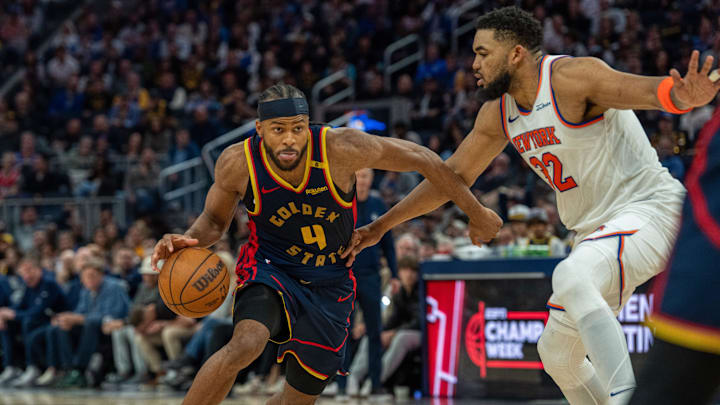 Golden State Warriors guard Moses Moody drives to the net against New York Knicks center Karl-Anthony Towns. Mandatory Credit: Neville E. Guard-Imagn Images