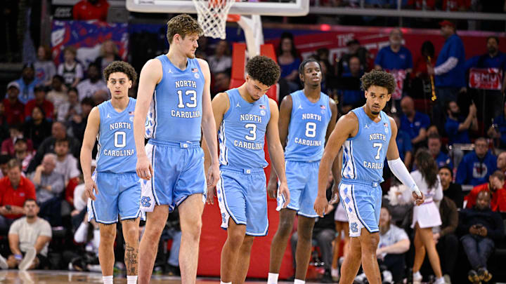 Jan 3, 2026; Dallas, Texas, USA; North Carolina Tar Heels guard Kyan Evans (0) and center Henri Veesaar (13) and guard Derek Dixon (3) and forward Caleb Wilson (8) and 
b7#2 come back on the court during the second half against the SMU Mustangs at Moody Coliseum. Mandatory Credit: Jerome Miron-Imagn Images