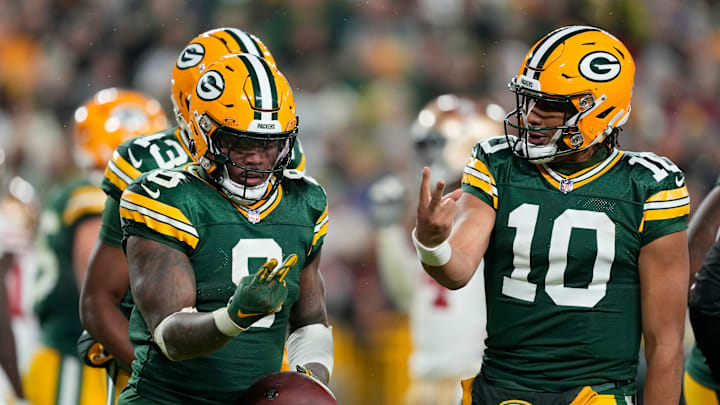 Green Bay Packers running back Josh Jacobs and quarterback Jordan Love
