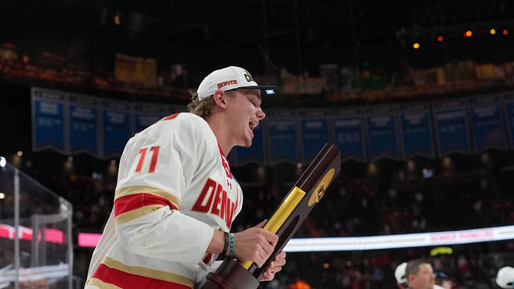 Apr 11, 2026; Las Vegas, Nevada, United States; Denver Pioneers forward Samu Salminen (11) skates with the trophy after defeating the Wisconsin Badgers in the championship game of the NCAA men's ice hockey Frozen Four at T-Mobile Arena. Mandatory Credit: Lucas Peltier-Imagn Images Apr 11, 2026; Las Vegas, Nevada, United States; Denver Pioneers forward Samu Salminen (11) skates with the trophy after defeating the Wisconsin Badgers in the championship game of the NCAA men's ice hockey Frozen Four at T-Mobile Arena. Mandatory Credit: Lucas Peltier-Imagn Images