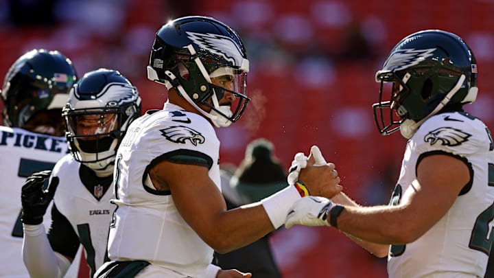 Dec 22, 2024; Landover, Maryland, USA; Philadelphia Eagles quarterback Jalen Hurts (1) greets running back Will Shipley (28) before playing against the Washington Commanders at Northwest Stadium. 