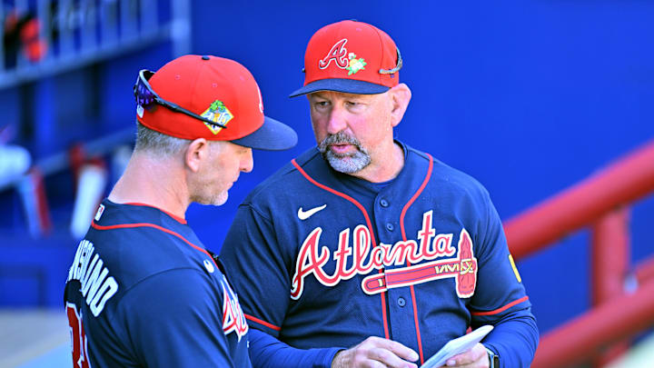 Feb 25, 2026; North Port, Florida, USA;  Atlanta Braves manager Walt Weiss (4) talks with bench coach Tony Mansolino (89) before the start of the game against the Pittsburgh Pirates during spring training at CoolToday Park. Mandatory Credit: Jonathan Dyer-Imagn Images