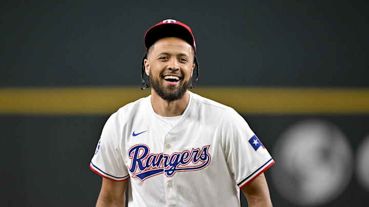 Jul 2, 2025; Arlington, Texas, USA; Detroit Pistons point guard Cade Cunningham reacts after he throws out the first pitch before the game between the Texas Rangers and the Baltimore Orioles at Globe Life Field. Mandatory Credit: Jerome Miron-Imagn Images