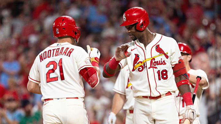 Sep 30, 2023; St. Louis, Missouri, USA; St. Louis Cardinals right fielder Jordan Walker (18) celebrates with his teammate St. Louis Cardinals center fielder Lars Nootbaar (21) for his homerun against the Cincinnati Reds in the second inning at Busch Stadium. Mandatory Credit: Zach Dalin-Imagn Images