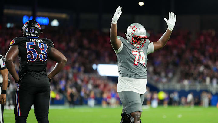 Sep 13, 2024; Kansas City, Kansas, USA; UNLV Rebels offensive lineman Jalen St. John (74) celebrates after the go-ahead touchdown late in the second half against the Kansas Jayhawks at Children's Mercy Park. Sep 13, 2024; Kansas City, Kansas, USA; UNLV Rebels offensive lineman Jalen St. John (74) celebrates after the go-ahead touchdown late in the second half against the Kansas Jayhawks at Children's Mercy Park.