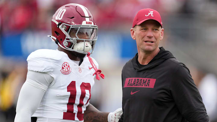 Jan 1, 2026; Pasadena, CA, USA; Alabama Crimson Tide head coach Kalen Deboer talks with quarterback Austin Mack (10) before the 2026 Rose Bowl and quarterfinal game of the College Football Playoff against the Indiana Hoosiers at Rose Bowl Stadium. Mandatory Credit: Kirby Lee-Imagn Images