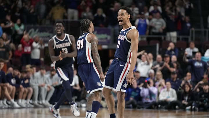 Gonzaga Bulldogs forward Graham Ike (13), guard Khalif Battle (99), and guard Nolan Hickman (11). 