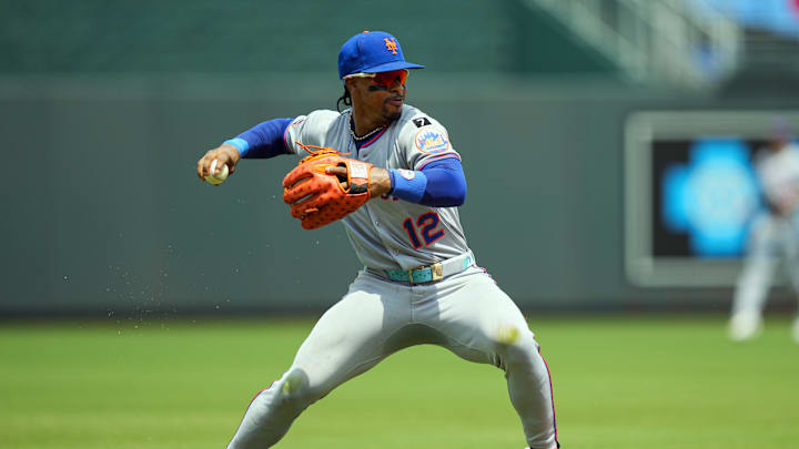 Jul 13, 2025; Kansas City, Missouri, USA; New York Mets shortstop Francisco Lindor (12) throws to first base during the second inning against the Kansas City Royals at Kauffman Stadium. Mandatory Credit: Jay Biggerstaff-Imagn Images