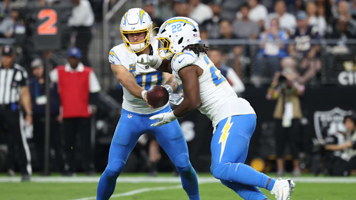 Sep 15, 2025; Paradise, Nevada, USA; Los Angeles Chargers quarterback Justin Herbert (10) hands the ball off to Los Angeles Chargers running back Najee Harris (22) during the second quarter against the Las Vegas Raiders at Allegiant Stadium. Mandatory Credit: Kiyoshi Mio-Imagn Images