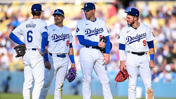 Jul 21, 2024; Los Angeles, California, USA; Los Angeles Dodgers second base Cavan Biggio (6), third baseman Enrique Hernández (8), first baseman Freddie Freeman (5), and second baseman Gavin Lux (9) meet on the field against the Boston Red Sox during the sixth inning at Dodger Stadium. Mandatory Credit: Jonathan Hui-Imagn Images