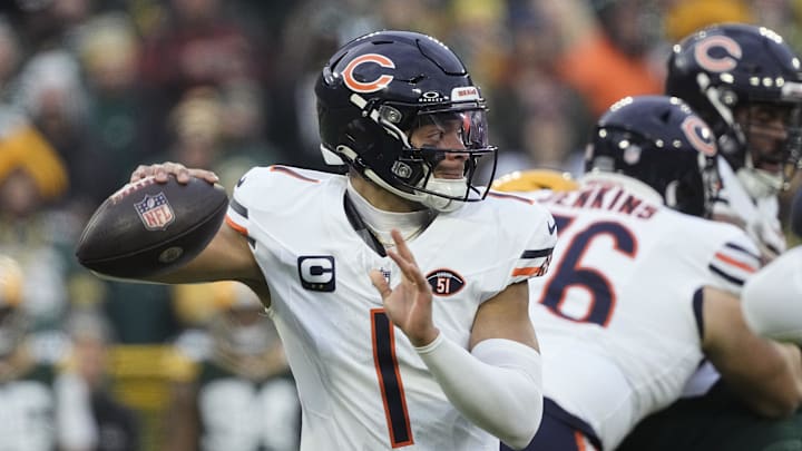 Jan 7, 2024; Green Bay, Wisconsin, USA;  Chicago Bears quarterback Justin Fields (1) throws a pass in the season finale against the Packers. 