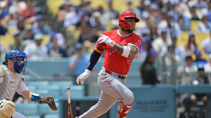 May 18, 2025; Los Angeles, California, USA;  Los Angeles Angels third base Yoan Moncada (5) hits a single in the third inning against the Los Angeles Dodgers at Dodger Stadium. Mandatory Credit: Jayne Kamin-Oncea-Imagn Images