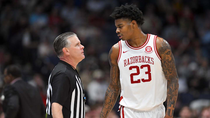 Mar 15, 2026; Nashville, TN, USA; Arkansas Razorbacks forward Nick Pringle (23) speaks with official 
Joe Lindsay in the second half during the men's SEC Conference Tournament Championship against the Vanderbilt Commodores at Bridgestone Arena. Mandatory Credit: Steve Roberts-Imagn Images