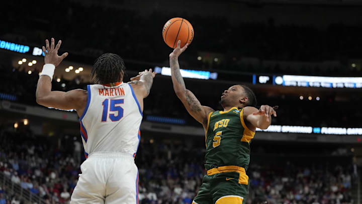 Mar 21, 2025; Raleigh, NC, USA;  Norfolk State Spartans guard Brian Moore Jr. (5) shoots the ball against Florida Gators guard Alijah Martin (15) during the second half at Lenovo Center. Mandatory Credit: Bob Donnan-Imagn Images