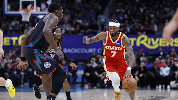 Mar 25, 2026; Detroit, Michigan, USA;  Atlanta Hawks guard Nickeil Alexander-Walker (7) dribbles defended by Detroit Pistons center Jalen Duren (0) in overtime at Little Caesars Arena. Mandatory Credit: Rick Osentoski-Imagn Images