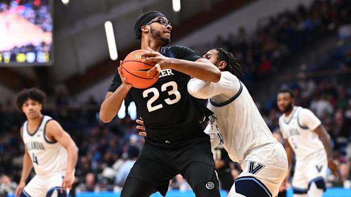 Mar 1, 2025; Villanova, Pennsylvania, USA; Butler Bulldogs center Andre Screen (23) drives against Villanova Wildcats forward Eric Dixon (43) in the second half at William B. Finneran Pavilion. 