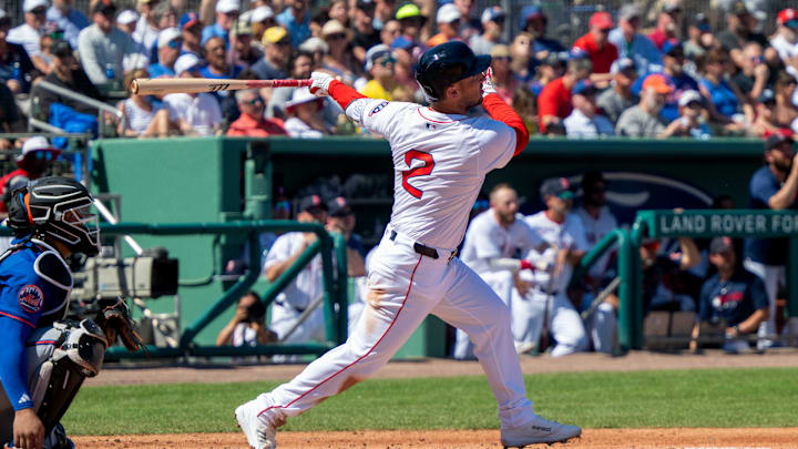 Boston Red Sox Alex Bregman (2) connects with the ball for a single during the first inning of their game with the New York Mets at JetBlue Park at Fenway South on March 2.