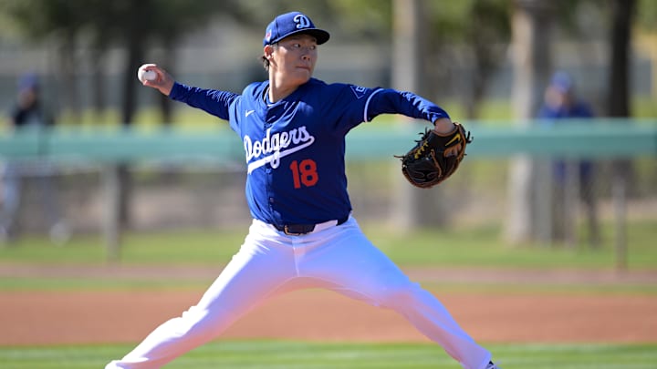 Feb 17, 2024; Glendale, AZ, USA;  Los Angeles Dodgers starting pitcher Yoshinobu Yamamoto (18)