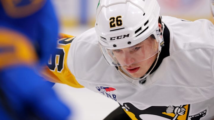 Sep 21, 2024; Buffalo, New York, USA;  Pittsburgh Penguins center Tristan Broz (26) waits for the face-off during the first period against the Buffalo Sabres at KeyBank Center. Mandatory Credit: Timothy T. Ludwig-Imagn Images