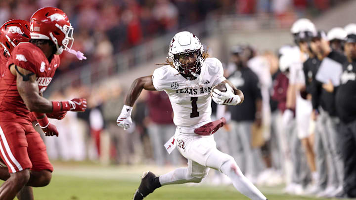 Oct 18, 2025; Fayetteville, Arkansas, USA; Texas A&M Aggies wide receiver Izaiah Williams (1) runs after a catch during the fourth quarter against the Arkansas Razorbacks at Donald W. Reynolds Razorback Stadium. Mandatory Credit: Nelson Chenault-Imagn Images Oct 18, 2025; Fayetteville, Arkansas, USA; Texas A&M Aggies wide receiver Izaiah Williams (1) runs after a catch during the fourth quarter against the Arkansas Razorbacks at Donald W. Reynolds Razorback Stadium. Mandatory Credit: Nelson Chenault-Imagn Images