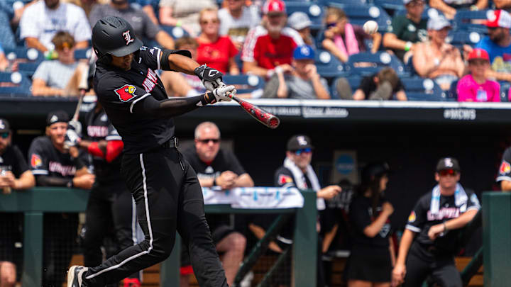 Jun 17, 2025; Omaha, Neb, USA; Louisville Cardinals third baseman Jake Munroe (20) hits a two-run home run against the Oregon State Beavers during the third inning at Charles Schwab Field. Mandatory Credit: Dylan Widger-Imagn Images Jun 17, 2025; Omaha, Neb, USA; Louisville Cardinals third baseman Jake Munroe (20) hits a two-run home run against the Oregon State Beavers during the third inning at Charles Schwab Field. Mandatory Credit: Dylan Widger-Imagn Images