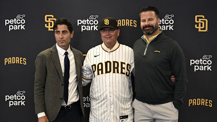 San Diego Padres manager Mike Shildt (center) poses for a photograph with president of baseball operations and general manager A.J. Preller (left) and chief executive officer Erik Greupner after a press conference announcing the hiring of Shildt at Petco Park on Nov. 21, 2023.