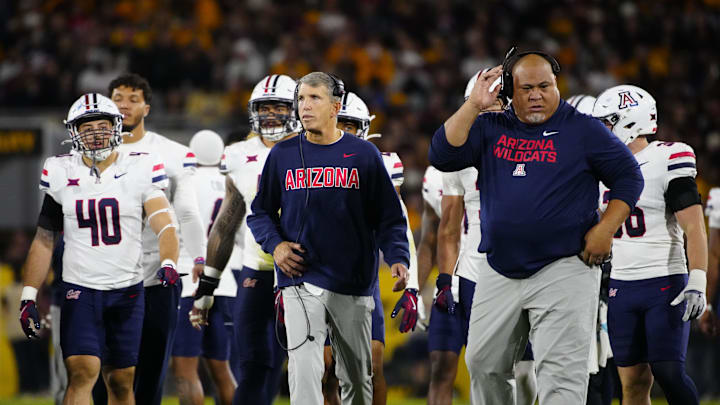 Arizona head coach Brent Brennan walks to the end zone with his team during a game against Arizona State at Mountain America Stadium in Tempe on Nov. 28, 2025. Arizona head coach Brent Brennan walks to the end zone with his team during a game against Arizona State at Mountain America Stadium in Tempe on Nov. 28, 2025.