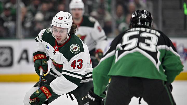 Apr 20, 2026; Dallas, Texas, USA; Minnesota Wild defenseman Quinn Hughes (43) skates past Dallas Stars center Wyatt Johnston (53) during the game between the Stars and the Wild in game two of the first round of the 2026 Stanley Cup Playoffs at American Airlines Center. Mandatory Credit: Jerome Miron-Imagn Images