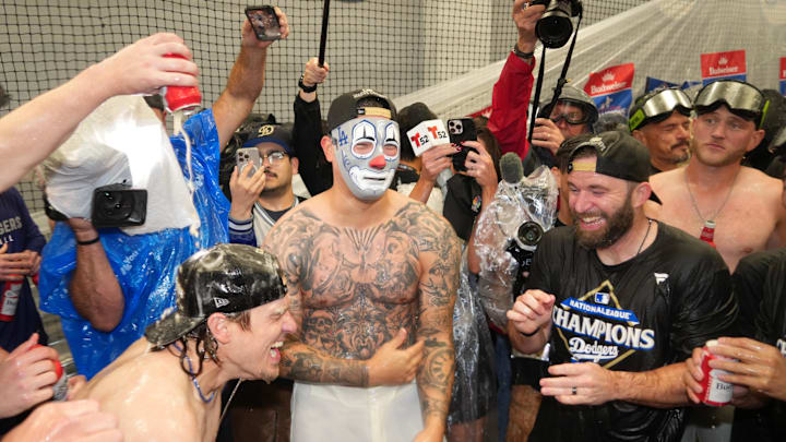 Oct 17, 2025; Los Angeles, California, USA; Los Angeles Dodgers pitcher Anthony Banda (43, center) celebrates with teammates in the clubhouse after defeating the Milwaukee Brewers in game four of the NLCS round for the 2025 MLB playoffs at Dodger Stadium. Mandatory Credit: Kirby Lee-Imagn Images Oct 17, 2025; Los Angeles, California, USA; Los Angeles Dodgers pitcher Anthony Banda (43, center) celebrates with teammates in the clubhouse after defeating the Milwaukee Brewers in game four of the NLCS round for the 2025 MLB playoffs at Dodger Stadium. Mandatory Credit: Kirby Lee-Imagn Images