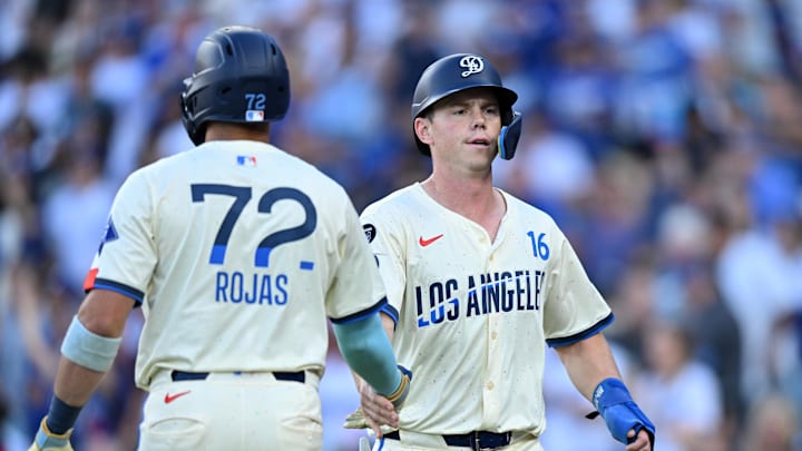 Aug 16, 2025; Los Angeles, California, USA; Los Angeles Dodgers catcher Will Smith (16) celebrates with second baseman Miguel Rojas (72) after scoring during the first inning at Dodger Stadium. Mandatory Credit: William Liang-Imagn Images Aug 16, 2025; Los Angeles, California, USA; Los Angeles Dodgers catcher Will Smith (16) celebrates with second baseman Miguel Rojas (72) after scoring during the first inning at Dodger Stadium. Mandatory Credit: William Liang-Imagn Images