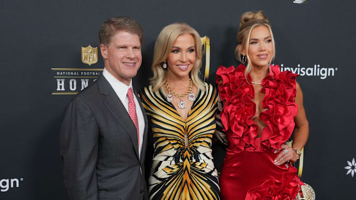 Feb 6, 2025; New Orleans, LA, USA;  Kansas City Chiefs owner Clark Hunt (left) with his wife Tavia Shackles (center) and daughter Gracie Hunt (right)  on the red carpet before Super Bowl LIX NFL Honors at Saenger Theatre. Mandatory Credit: Kirby Lee-Imagn Images